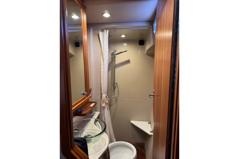 Vita Nova Yacht Photos Pics Compact bathroom in 2018 Aspen C120 with glass sink and shower.