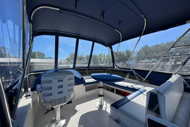 Vita Nova Yacht Photos Pics Interior view of 2018 Aspen C120 boat with seating and panoramic windows.