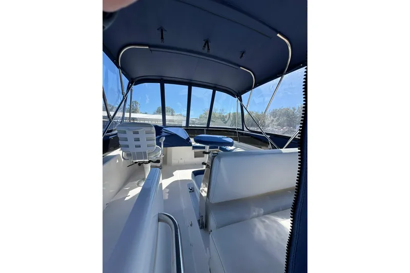 Vita Nova Yacht Photos Pics Interior of 2018 Aspen C120 boat with blue canopy and seating.