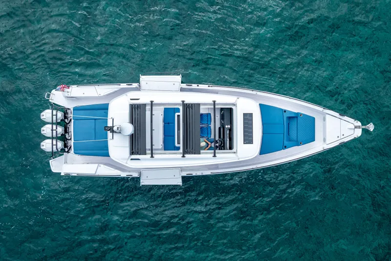  Yacht Photos Pics Overhead view of 2025 Axopar 45 Cross Top boat on clear blue water.