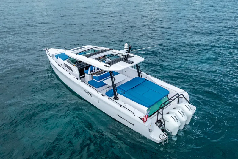  Yacht Photos Pics 2025 Axopar 45 Cross Top boat on clear blue water.