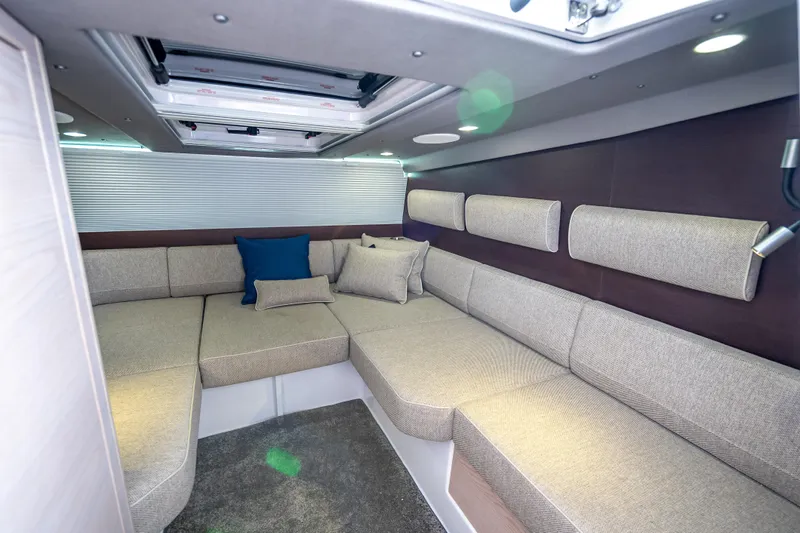  Yacht Photos Pics Luxurious interior of 2025 Axopar 45 Cross Top boat with comfortable seating and cushions.