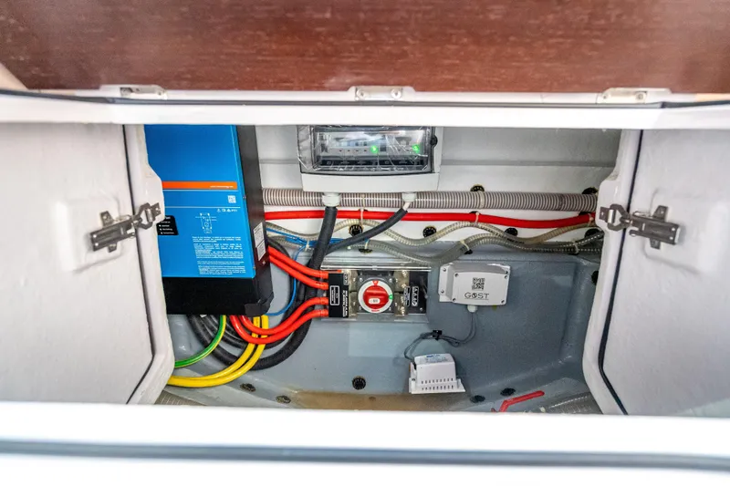  Yacht Photos Pics Electrical compartment of 2025 Axopar 45 Cross Top boat, featuring wiring and control systems.