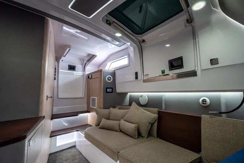  Yacht Photos Pics Luxurious interior of 2025 Axopar 45 Cross Top boat, featuring modern design and comfortable seating.