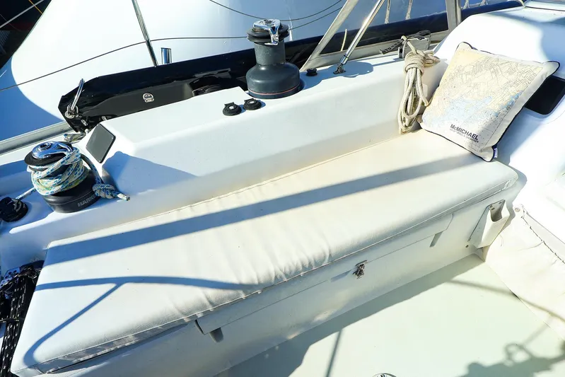 Mojo Yacht Photos Pics 2004 J Boats J/46 sailboat cockpit with winch, ropes, and cushion.