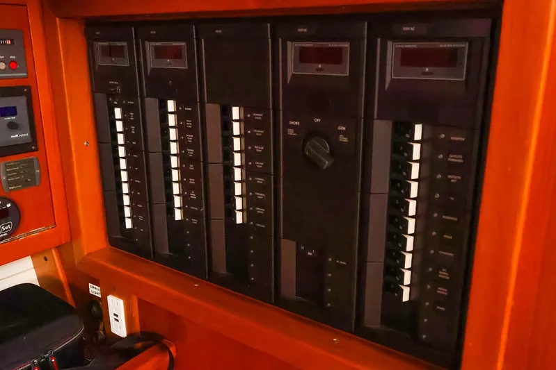 Mojo Yacht Photos Pics Electrical panel on a 2004 J Boats J/46 yacht, featuring multiple switches and controls.