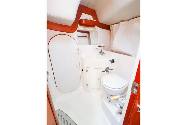 Mojo Yacht Photos Pics 2004 J Boats J/46 yacht bathroom with compact design and white fixtures.