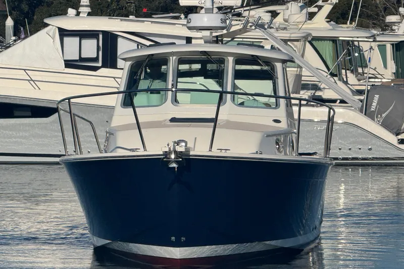 Indigo Yacht Photos Pics 2005 Back Cove 29 boat docked in marina, front view.