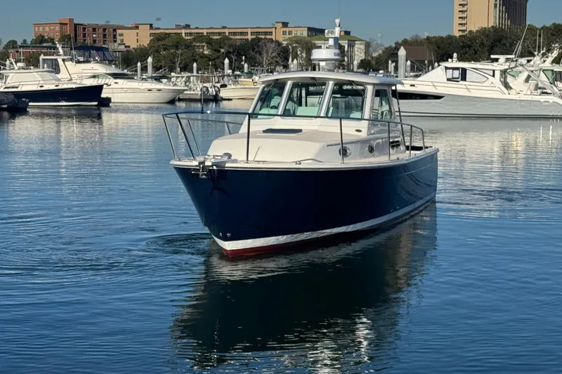 Indigo Yacht Photos Pics 2005 Back Cove 29 boat in marina, surrounded by other vessels.