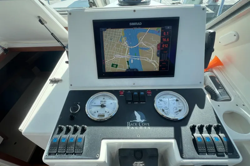 Indigo Yacht Photos Pics Control panel of a 2005 Back Cove 29 yacht with navigation display.