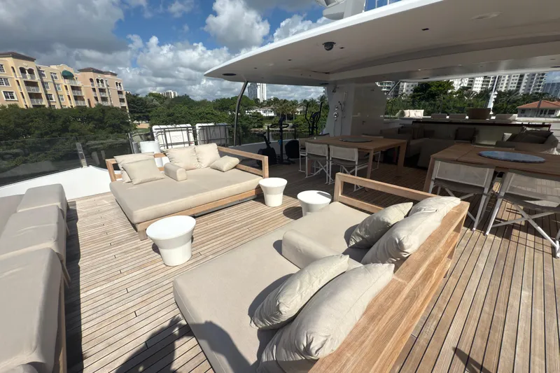 Mr. D Yacht Photos Pics Luxurious 2015 Benetti 140 yacht deck with elegant seating and dining area.