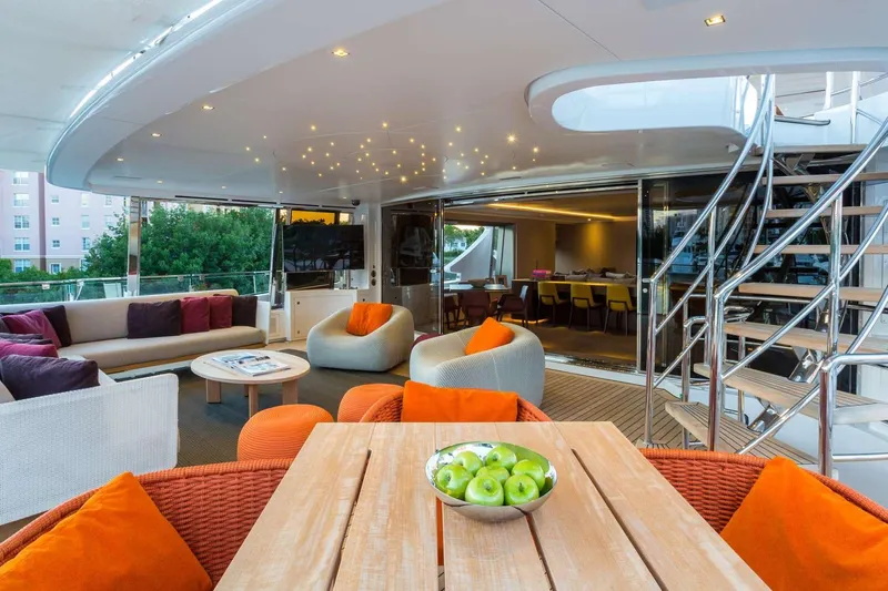 Mr. D Yacht Photos Pics Luxurious 2015 Benetti 140 yacht interior with modern seating, dining area, and decorative lighting.