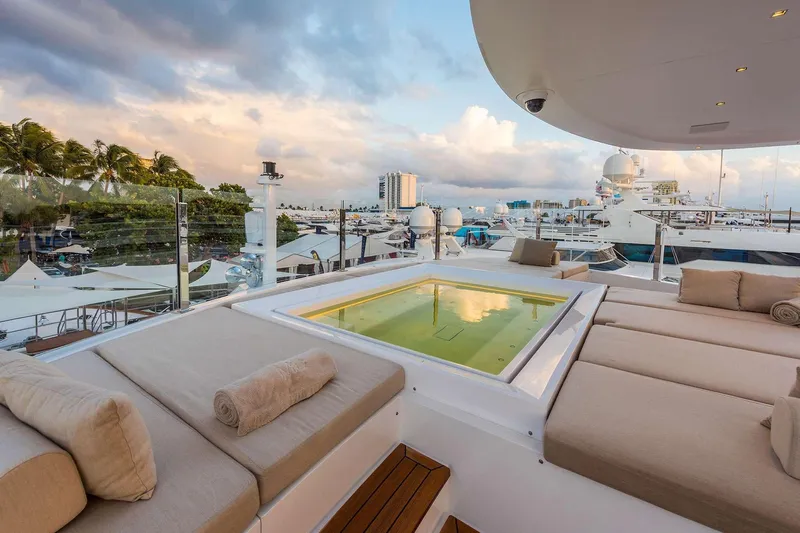 Mr. D Yacht Photos Pics Luxurious 2015 Benetti 140 yacht with sun deck and jacuzzi, docked at marina.