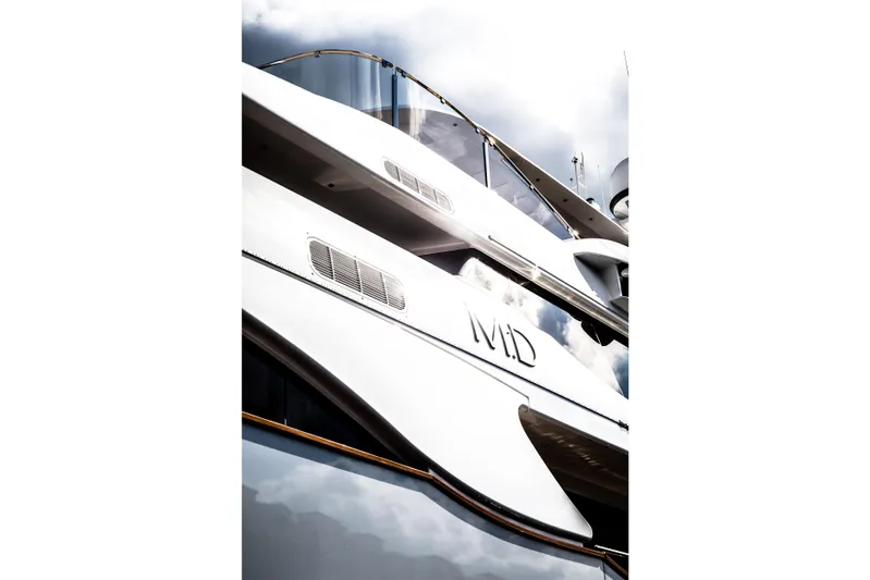 Mr. D Yacht Photos Pics Luxury Benetti 140 yacht, 2015 model, sleek design against cloudy sky.