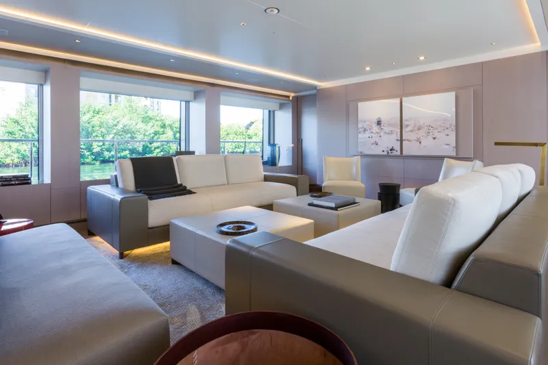 Mr. D Yacht Photos Pics Luxurious interior of a 2015 Benetti 140 yacht with modern seating and large windows.