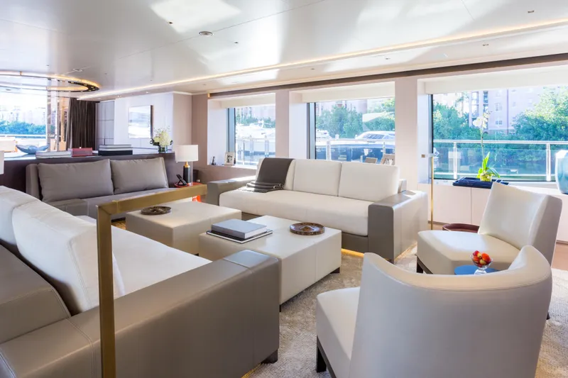 Mr. D Yacht Photos Pics Luxurious interior of 2015 Benetti 140 yacht with modern seating and large windows.