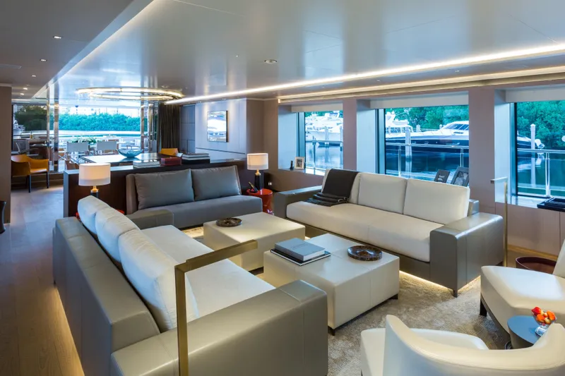 Mr. D Yacht Photos Pics Luxurious interior of 2015 Benetti 140 yacht with modern seating and large windows.
