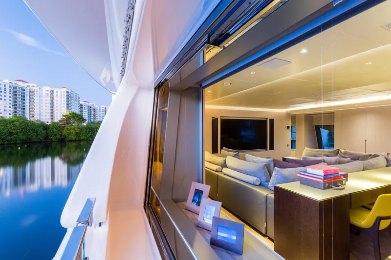 Mr. D Yacht Photos Pics Luxurious interior of a 2015 Benetti 140 yacht with scenic waterfront view.