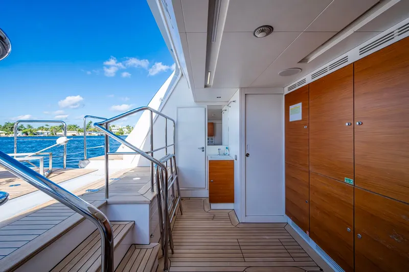 Mr. D Yacht Photos Pics Luxurious 2015 Benetti 140 yacht deck with wooden flooring and ocean view.