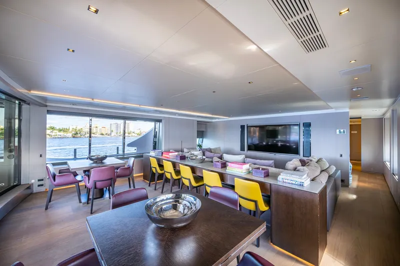 Mr. D Yacht Photos Pics Luxurious interior of 2015 Benetti 140 yacht with modern dining and lounge area.