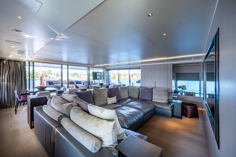 Mr. D Yacht Photos Pics Luxurious interior of 2015 Benetti 140 yacht with spacious seating and panoramic windows.