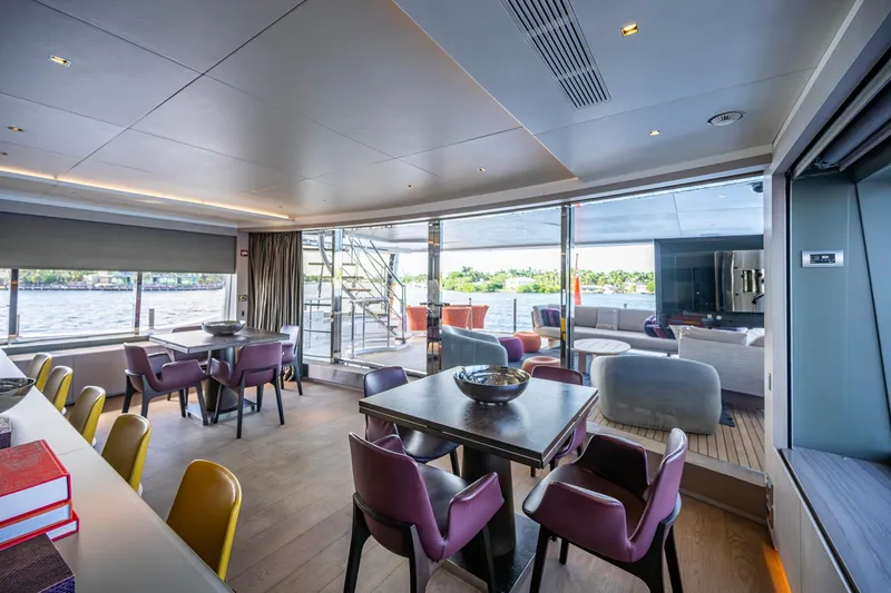 Mr. D Yacht Photos Pics Luxurious interior of 2015 Benetti 140 yacht with modern dining and lounge areas.