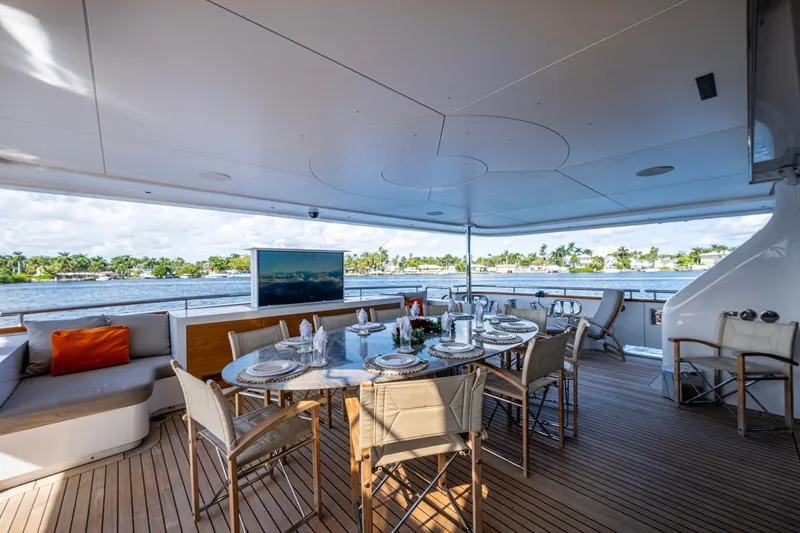 Mr. D Yacht Photos Pics Luxurious dining area on 2015 Benetti 140 yacht with scenic water views.