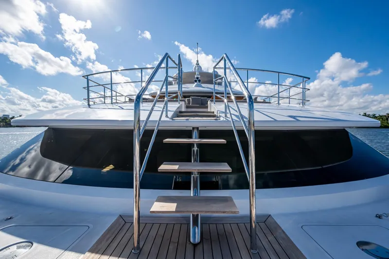 Mr. D Yacht Photos Pics Luxury Benetti 140 yacht, 2015 model, featuring sleek design and elegant outdoor staircase.