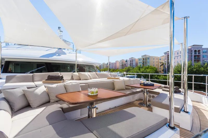 Mr. D Yacht Photos Pics Luxurious 2015 Benetti 140 yacht deck with elegant seating and shade sails.