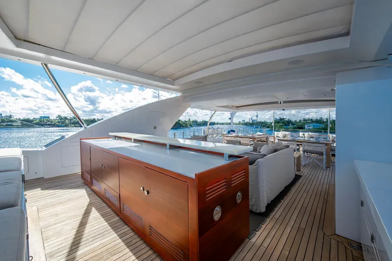 Mr. D Yacht Photos Pics Luxurious 2015 Benetti 140 yacht deck with elegant seating and ocean view.