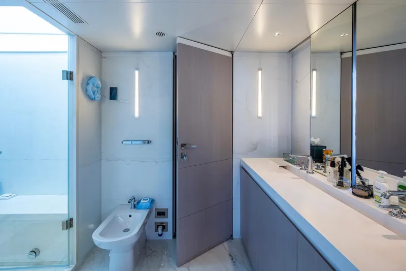 Mr. D Yacht Photos Pics Luxurious bathroom on 2015 Benetti 140 yacht, featuring modern fixtures and elegant design.