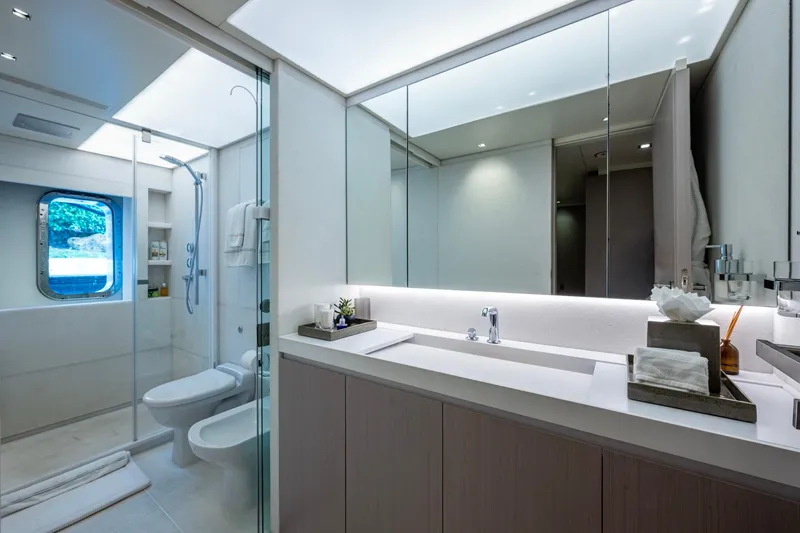 Mr. D Yacht Photos Pics Luxurious bathroom on 2015 Benetti 140 yacht, featuring modern fixtures and elegant design.