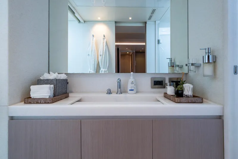 Mr. D Yacht Photos Pics Luxurious bathroom vanity on 2015 Benetti 140 yacht, featuring modern fixtures and elegant decor.