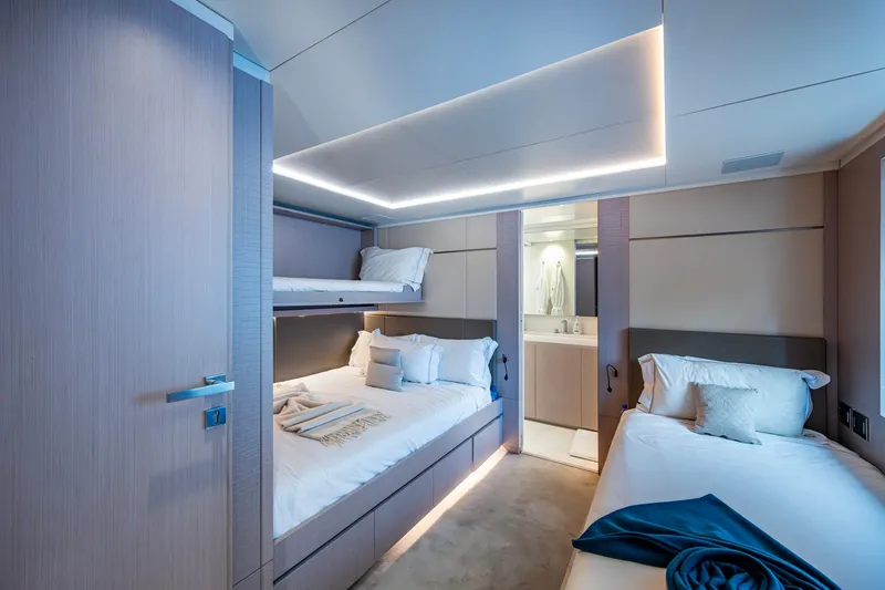 Mr. D Yacht Photos Pics Luxurious Benetti 140 yacht bedroom interior, 2015 model, featuring modern design and cozy bedding.