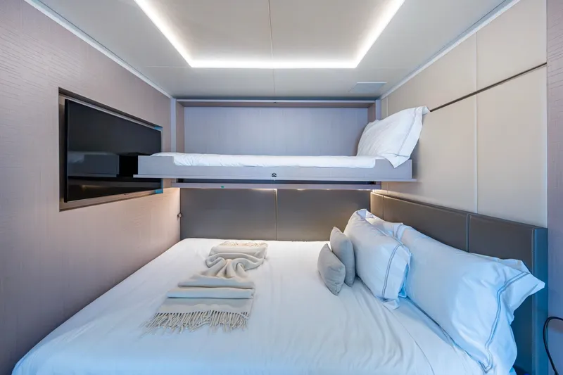 Mr. D Yacht Photos Pics Luxurious bedroom with bunk beds on a 2015 Benetti 140 yacht.