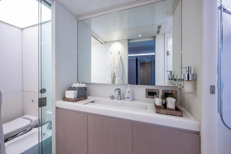 Mr. D Yacht Photos Pics Luxurious bathroom on 2015 Benetti 140 yacht with modern fixtures and elegant design.