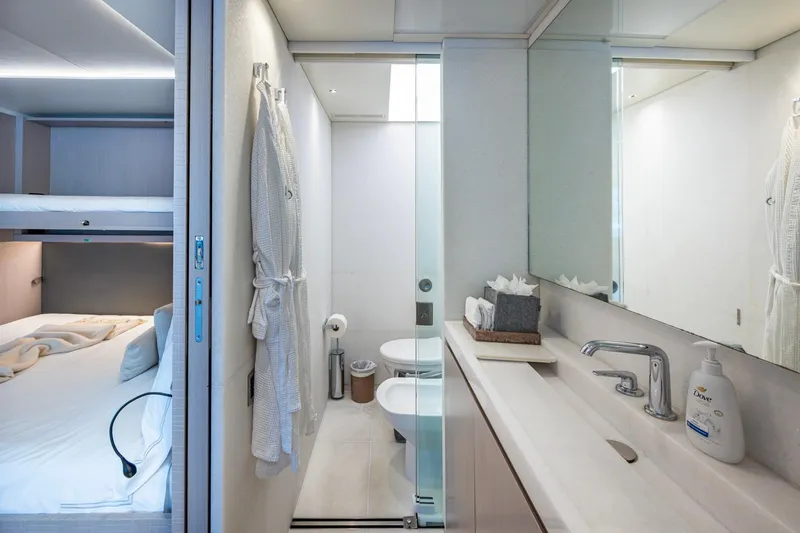 Mr. D Yacht Photos Pics Luxurious Benetti 140 yacht interior, featuring a modern bathroom and cozy bedroom, 2015 model.