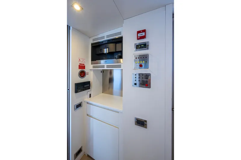 Mr. D Yacht Photos Pics Control panel area on 2015 Benetti 140 yacht, featuring modern equipment and sleek design.