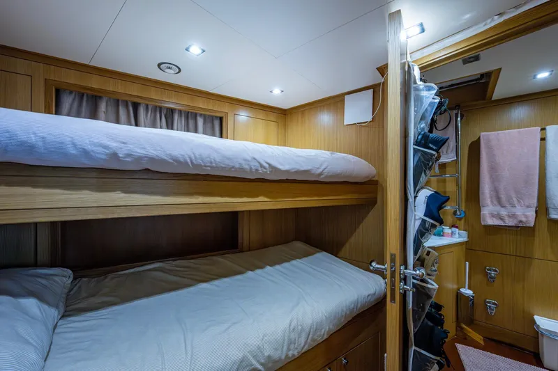 Mr. D Yacht Photos Pics Luxurious 2015 Benetti 140 yacht cabin with wooden bunk beds and modern amenities.