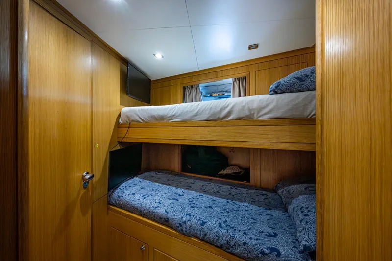 Mr. D Yacht Photos Pics Luxurious Benetti 140 yacht cabin with wooden interior and cozy bunk beds, 2015 model.
