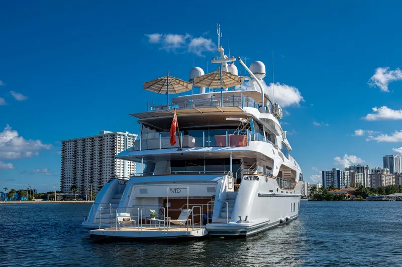 Mr. D Yacht Photos Pics Luxurious 2015 Benetti 140 yacht docked with city skyline backdrop.
