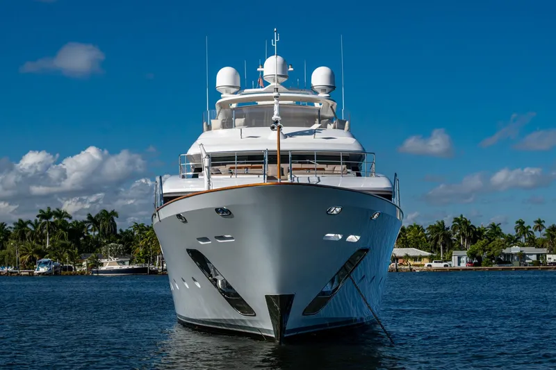Mr. D Yacht Photos Pics Luxurious 2015 Benetti 140 yacht on serene water under clear blue sky.