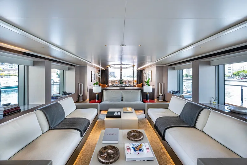 Mr. D Yacht Photos Pics Luxurious interior of 2015 Benetti 140 yacht with elegant seating and panoramic windows.