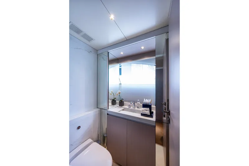 Mr. D Yacht Photos Pics Luxurious bathroom on 2015 Benetti 140 yacht with modern fixtures and elegant design.