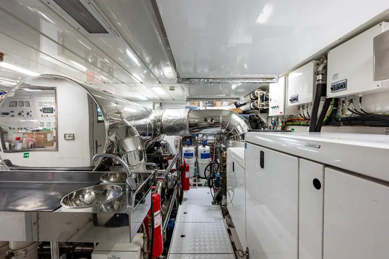 Mr. D Yacht Photos Pics Engine room of a 2015 Benetti 140 yacht, featuring modern equipment and sleek design.