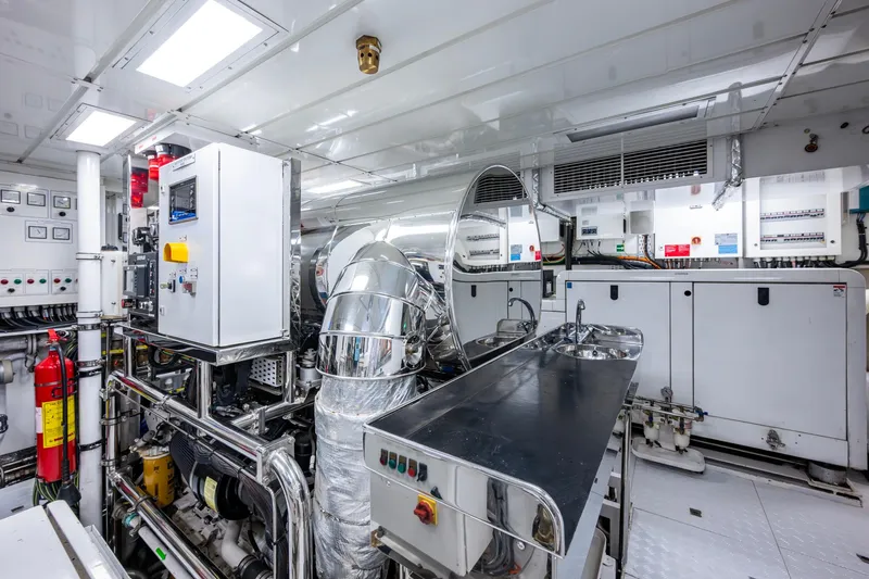 Mr. D Yacht Photos Pics Engine room of a 2015 Benetti 140 yacht, featuring advanced machinery and control systems.