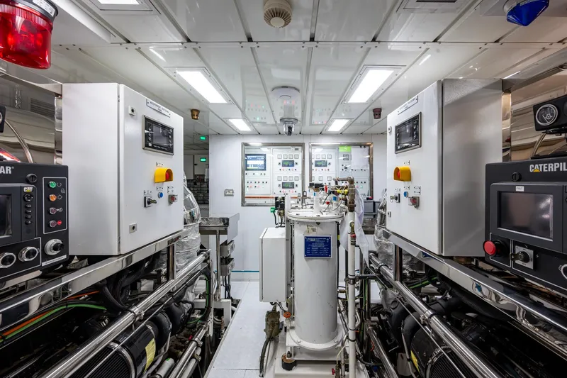 Mr. D Yacht Photos Pics Engine room of a 2015 Benetti 140 yacht with control panels and machinery.