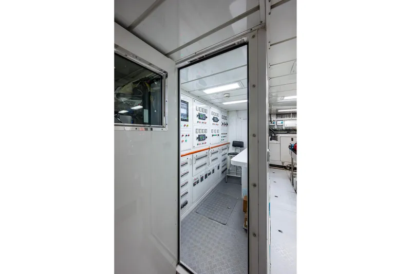 Mr. D Yacht Photos Pics Engine room of 2015 Benetti 140 yacht, featuring control panels and equipment.