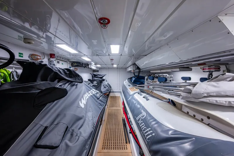 Mr. D Yacht Photos Pics Interior of a 2015 Benetti 140 yacht with watercraft storage.