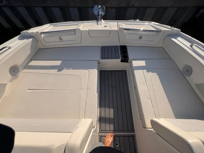  Yacht Photos Pics 2023 Aquila 32 Sport boat interior with seating and deck details.